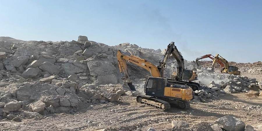 Excavators working on a rock site