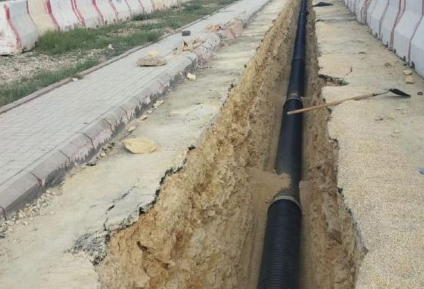 Sewage pipe laid in trench, Al-Qurayyat